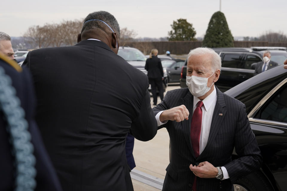 President Joe Biden elbow bumps Defense Secretary Lloyd Austin as he arrives at the Pentagon, Wednesday, Feb. 10, 2021, in Washington. (AP Photo/Patrick Semansky)