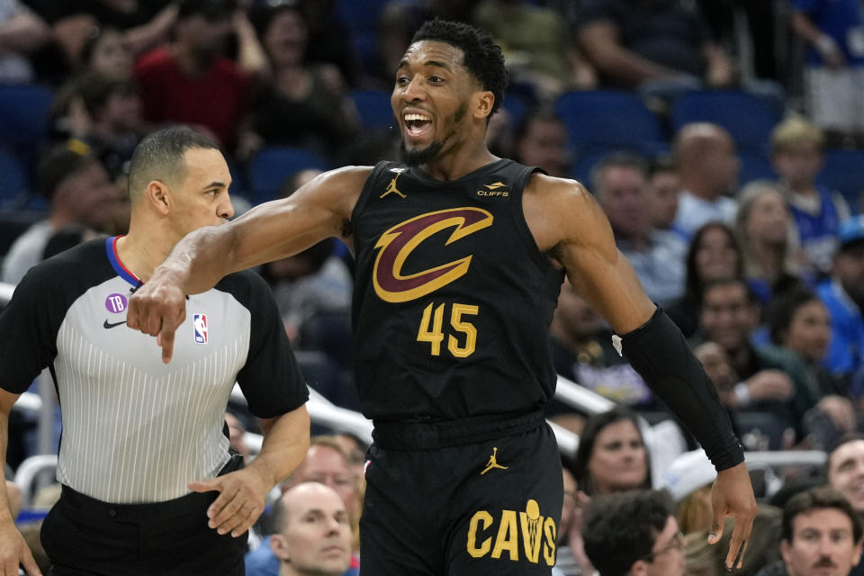 Cleveland Cavaliers' Donovan Mitchell (45) celebrates after making a 3-point shot against the Orlando Magic late in the second half of an NBA basketball game, Tuesday, April 4, 2023, in Orlando, Fla. (AP Photo/John Raoux)