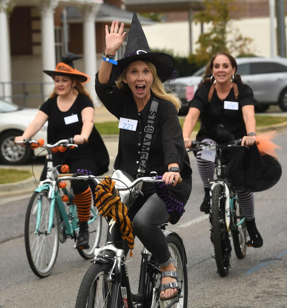 Witches take flight Oct. 16, 2022,  in Tuscaloosa to raise money for the Arc of Tuscaloosa County in the annual T-Town Witches Ride through downtown Tuscaloosa.