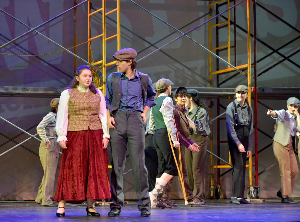 Barnstable High School seniors Maddy Brown, left, and Ryan Field perform "Carrying the Banner" with the cast of "Newsies," a 2011 musical that went to Broadway the following year and is still touring nationally. Brown plays protagonist Katherine "Plumber" Pulitzer and Field is her love interest Jack Kelly.