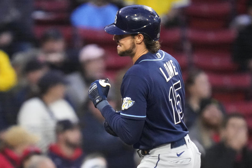 Tampa Bay Rays' Josh Lowe pumps his fist while rounding the bases on his solo home run during the second inning of a baseball game against the Boston Red Sox at Fenway Park, Wednesday, Sept. 27, 2023, in Boston. (AP Photo/Charles Krupa)