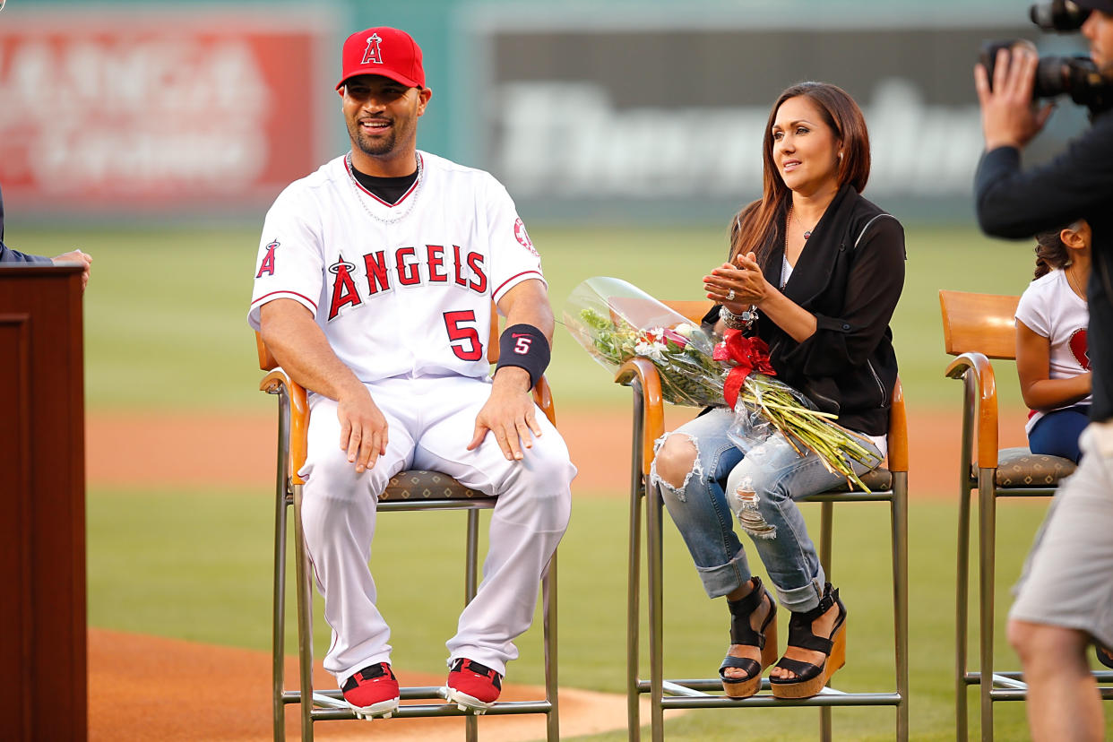 Albert Pujols is welcomed into the 500 Homerun Club next to his wife Deidre at Angel Stadium of Anaheim on June 7, 2014 in Anaheim, California. (Getty Images)