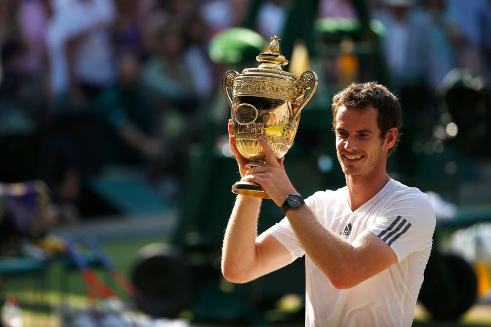 Murray celebrates his Wimbledon triumph in 2013 (PA Archive)