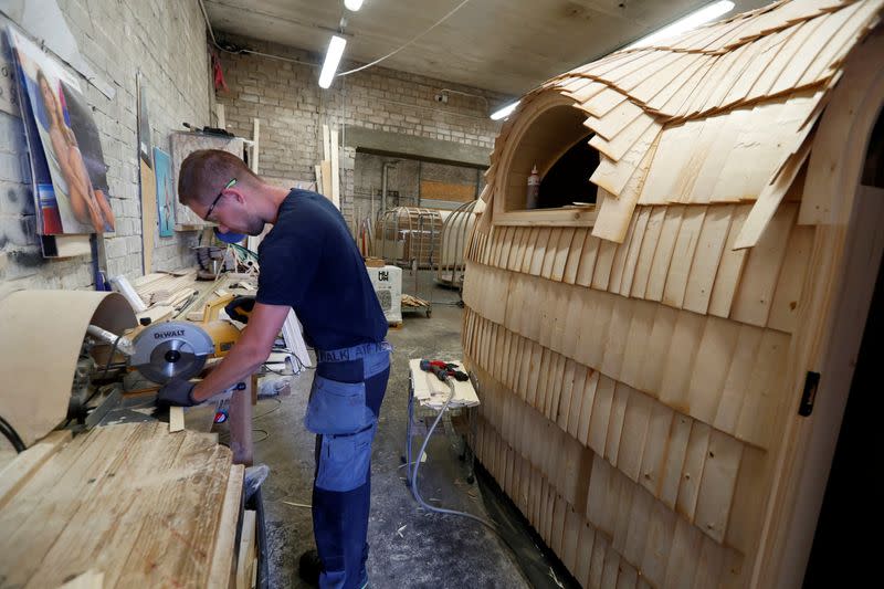 Iglucraft comapany worker works on the detail of the Iglusaun sauna in Leie