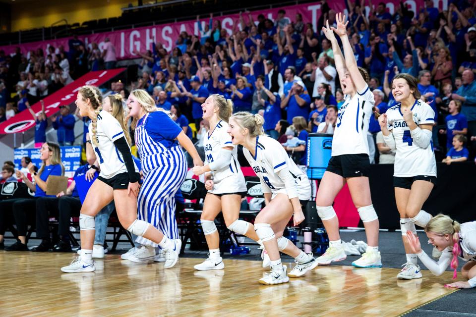 Ankeny Christian players celebrate during a Class 1A state volleyball championship match. They're the only returning state title holders in our midseason Super 10.