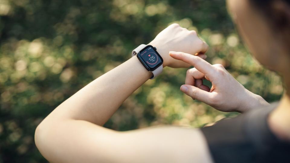 runner looking at sports watch