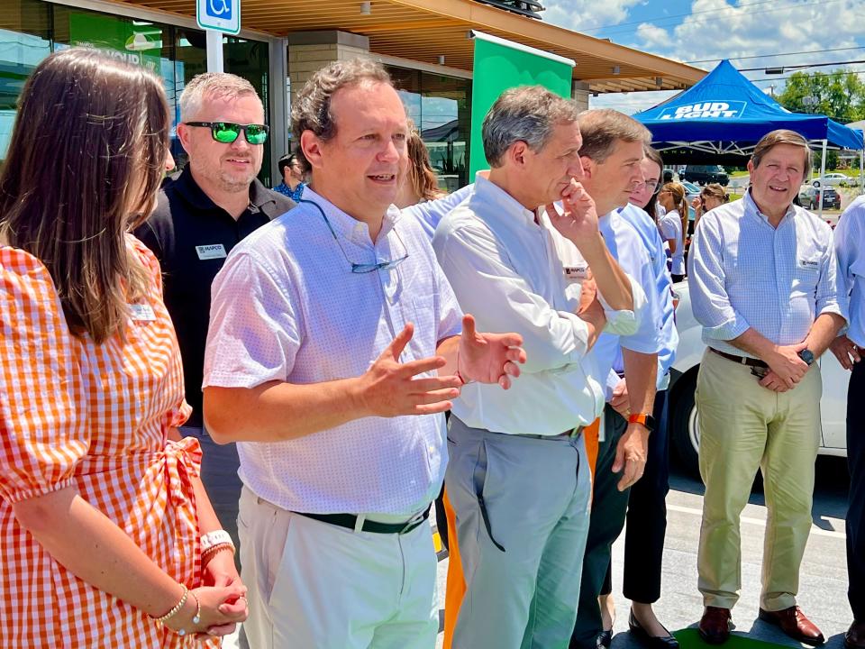 MAPCO CEO Frederic Chaveyriat, second from left, speaks during the new Carmack Boulevard gas station's grand opening Tuesday, May 30, 2022.