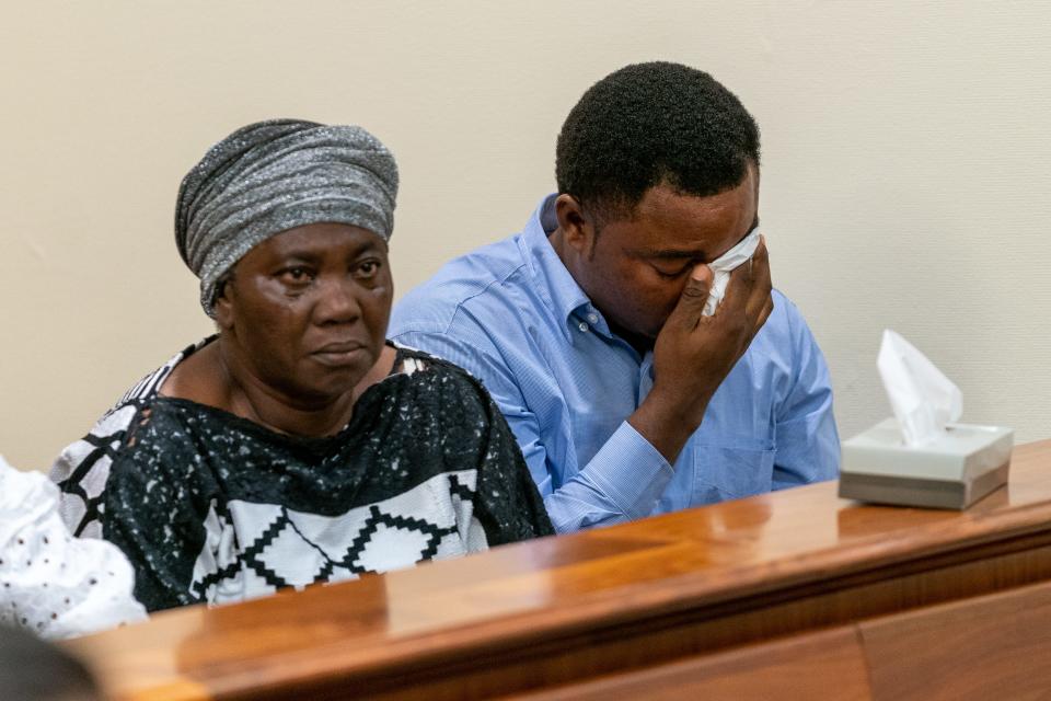 Mary Dwumfour, left, Eunice's mother, stares at Rashid Ali Bynum during his August arraignment and detention hearing in New Brunswick. To her right is Eunice's husband, Peter Ezechukwu.