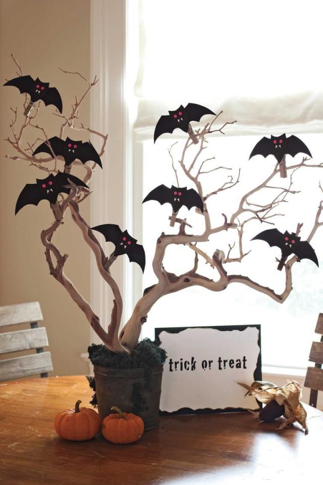 Halloween handmade decor. How to make funny paper bat. Cutting the shape  with scissors. Step 2. Top view, flat lay Stock Photo