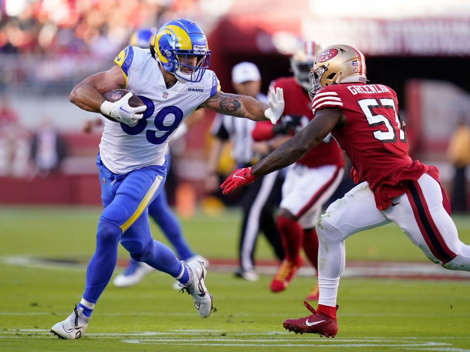 Tyler Higbee runs with the ball against the San Francisco 49ers.