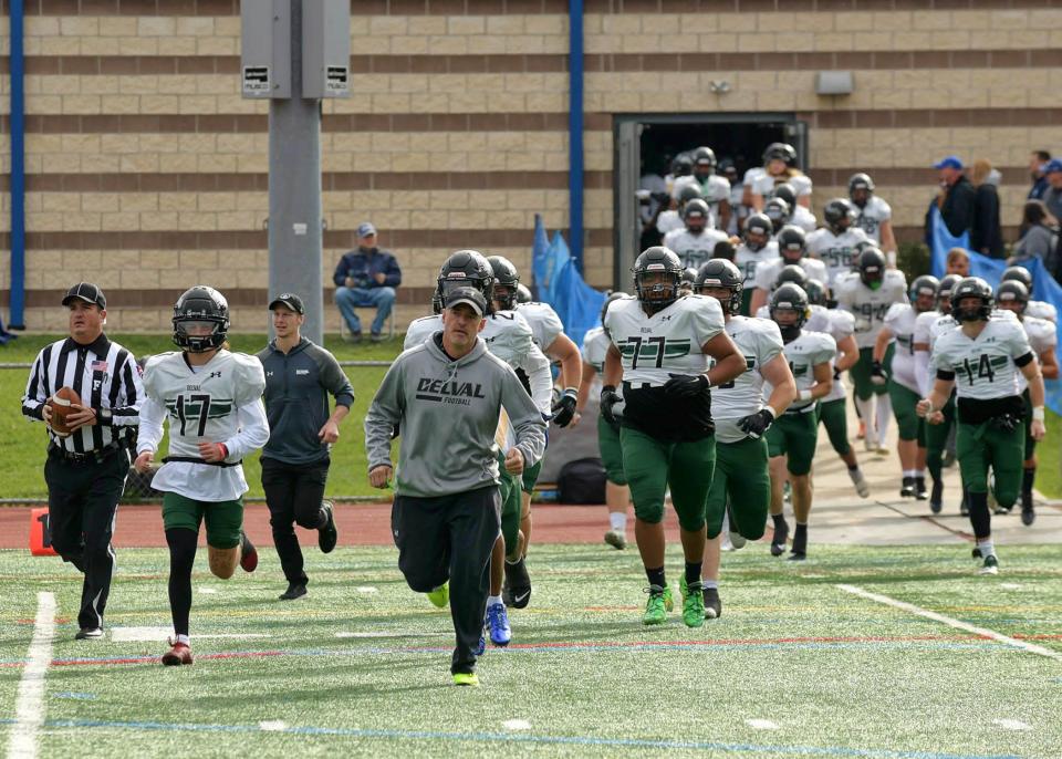 Delaware Valley University head coach Duke Greco leads the Aggies onto the field prior to their Middle Atlantic Conference-clinching win over Misericordia on Nov. 4.