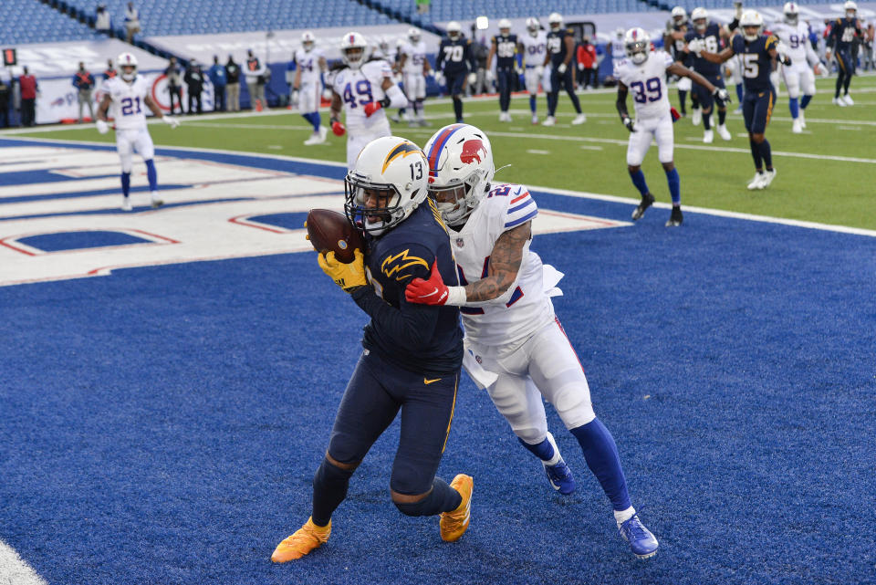 Los Angeles Chargers wide receiver Keenan Allen (13) catches a touchdown pass against Buffalo Bills cornerback Taron Johnson (24) during the second half of an NFL football game, Sunday, Nov. 29, 2020, in Orchard Park, N.Y. (AP Photo/Adrian Kraus )