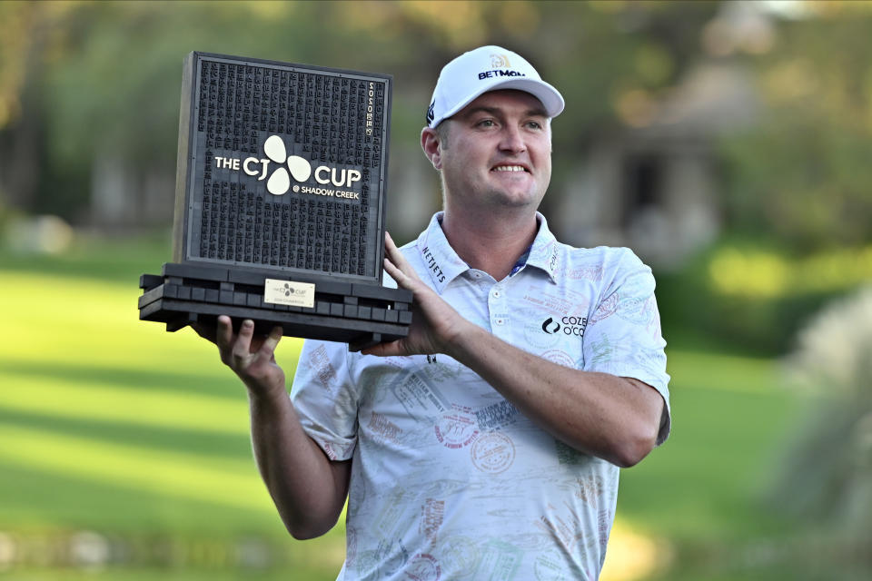 Jason Kokrak holds the championship trophy after winning the CJ Cup golf tournament at Shadow Creek Golf Course Sunday, Oct. 18, 2020, in North Las Vegas. (AP Photo/David Becker)