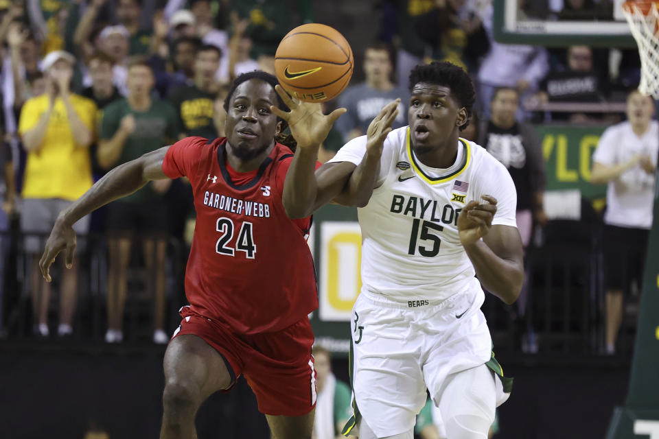 Baylor forward Josh Ojianwuna (15) and Gardner-Webb forward Isaiah Richards (24) go after the ball in the second half of an NCAA college basketball game, Sunday, Nov. 12, 2023, in Waco, Texas. (AP Photo/Jerry Larson)