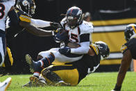 Denver Broncos inside linebacker A.J. Johnson (45) is tackled by Pittsburgh Steelers center Kendrick Green (53) after recovering a fumble my quarterback Ben Roethlisberger during the first half of an NFL football game in Pittsburgh, Sunday, Oct. 10, 2021. (AP Photo/Don Wright)