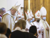 Pope Francis, left, concelebrates a mass in the Chaldean Cathedral of Saint Joseph, in Baghdad, Iraq, Saturday, March 6, 2021. Earlier today Francis met privately with the country's revered Shiite leader, Grand Ayatollah Ali al-Sistani. (AP Photo/Andrew Medichini)