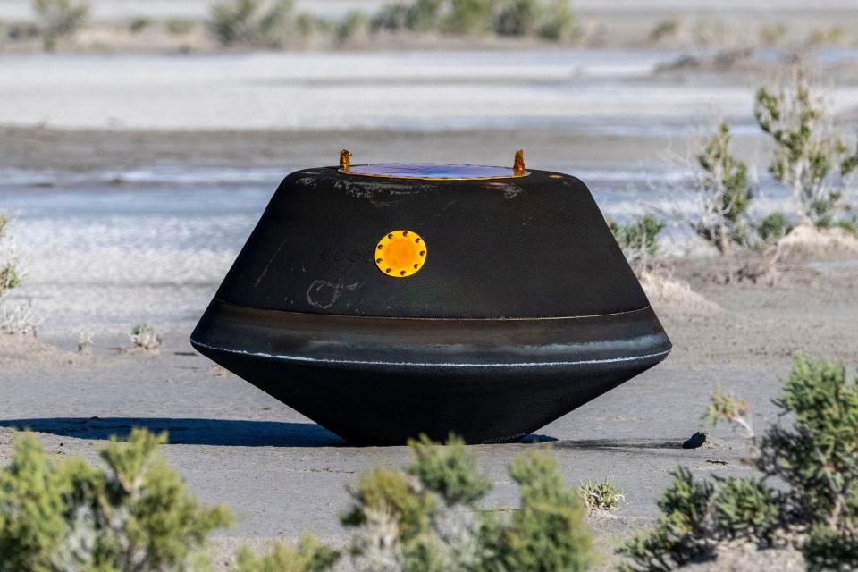 In this handout provided by NASA, the sample return capsule from NASA's OSIRIS-REx mission is seen shortly after touching down in the desert, on September 24, 2023 at the Department of Defense's Utah Test and Training Range in Dugway, Utah. The sample was collected from the asteroid Bennu in October 2020 by NASA's OSIRIS-REx spacecraft.