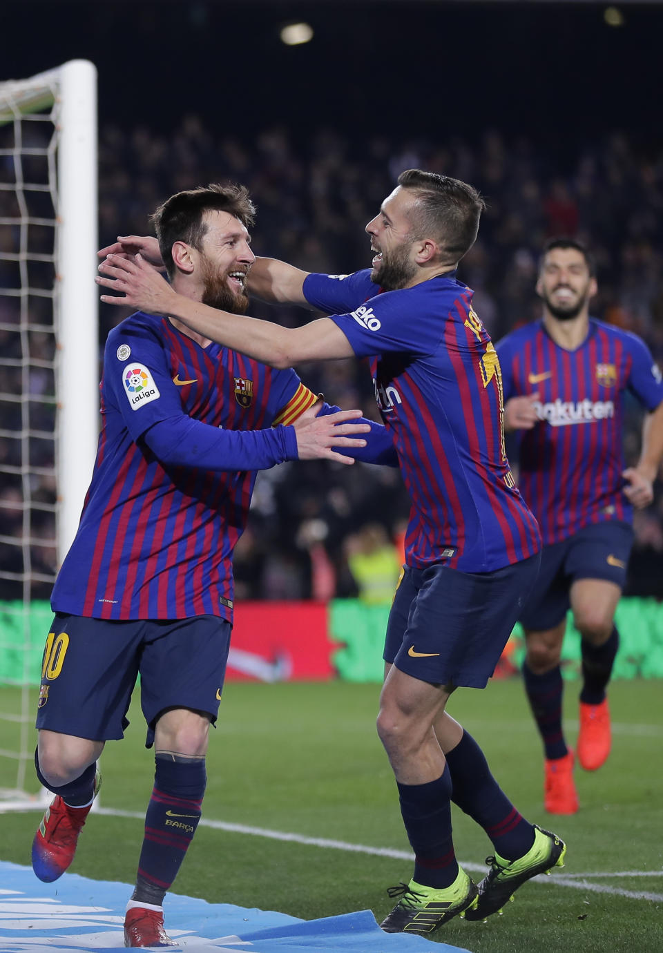 FC Barcelona's Lionel Messi, left, celebrates with his teammate Jordi Alba after scoring during the Spanish La Liga soccer match between FC Barcelona and Leganes at the Camp Nou stadium in Barcelona, Spain, Sunday, Jan. 20, 2019. (AP Photo/Manu Fernandez)