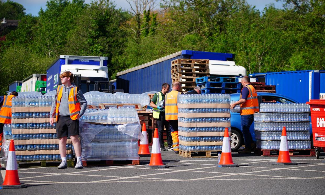 <span>A bottled-water collection point in Paignton, north of Brixham.</span><span>Photograph: Ben Birchall/PA</span>