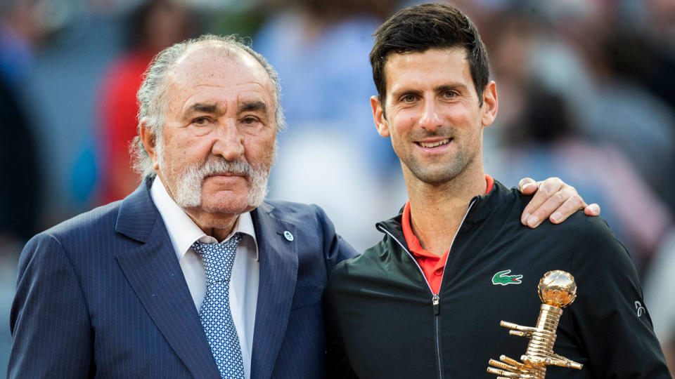 Madrid Open owner Ion Tiriac presents Novak Djokovic with the 2019 winner's trophy. Pic: Getty