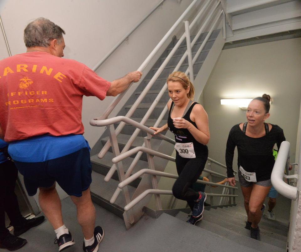 Stair climbers come past the 19th floor of the Bank of America Tower in downtown Jacksonville as part of the American Lung Association's 2020 Fight For Air Climb. The annual event raises funds for healthy air and lung disease research, education and advocacy.
