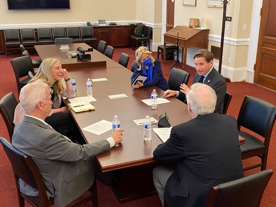 House members, from left to right, Bill Johnson, R-Ohio, Abigail Spanberger, D-V., Debbie Dingell, D-Mich. listen to Dean Phillips, D-Minn., as Braver Angels moderator William Doherty (back turned) watches on April 28 in Washington.