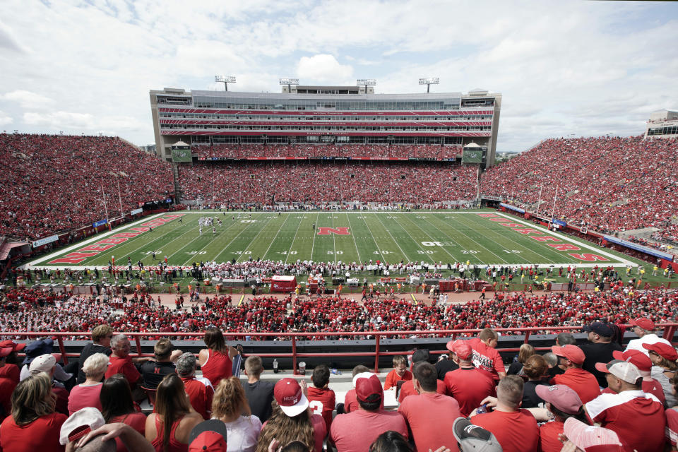 FILE- In this Aug. 31, 2019 file photo, Nebraska fans fill General Memorial Stadium in Lincoln, Neb., during an NCAA college football game between Nebraska and South Alabama. Faced with the possibility college football games will be played in stadiums with reduced capacities as a safeguard against coronavirus, athletic administrators at schools with high ticket demand are making plans to determine who gets a seat. This is a particularly painful task for athletic director Bill Moos of Nebraska, which has sold out every home football game since 1962. The Cornhuskers are a year-round passion in his state. The season ticket renewal rate for the 2020 season is a robust 93 percent. (AP Photo/Nati Harnik, file)