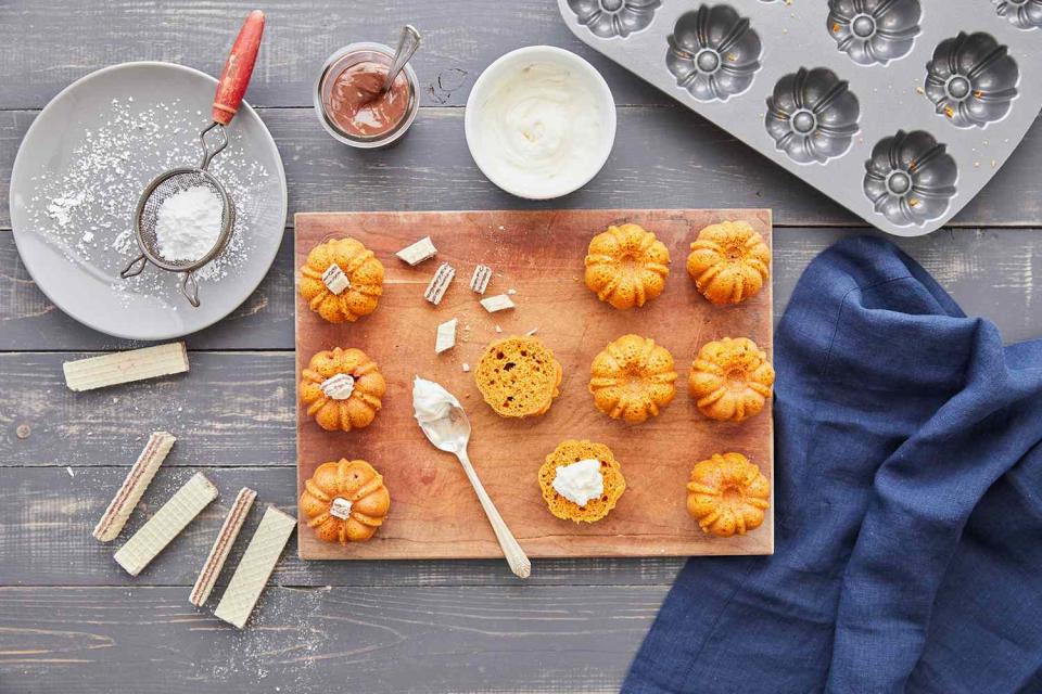 adding cookies and cream to mini pumpkin bundt cakes