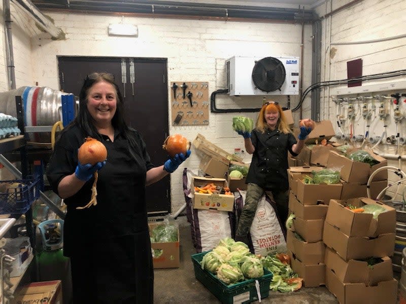 Volunteers at the Bevy pub take a delivery of surplus veg for their meals on wheels serviceBrighton Food Partnership