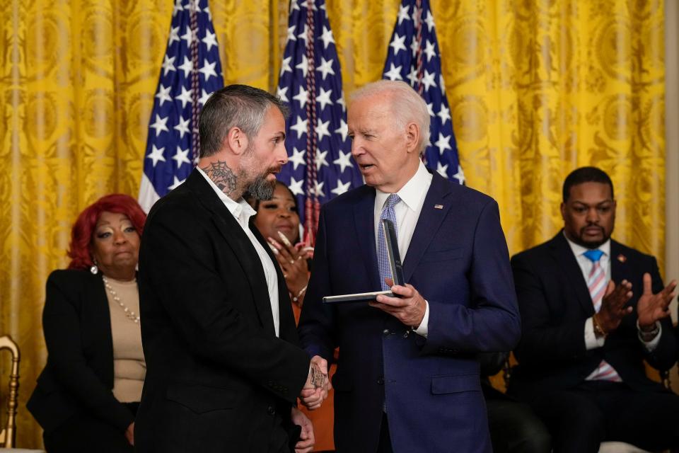 President Joe Biden presents Washington police officer Michael Fanone a Presidential Citizens Medal during a ceremony to mark the two-year anniversary of the Jan. 6, 2021, attack on the U.S. Capitol.