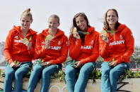 <p>Hungary’s Gabriella Szabo, Danuta Kozak, Tamara Csipes and Krisztina Fazekas-Zur celebrate their gold after the women’s kayak four 500m final during the 2016 Summer Olympics in Rio de Janeiro, Brazil, Saturday, Aug. 20, 2016. (AP Photo/Matt York) </p>