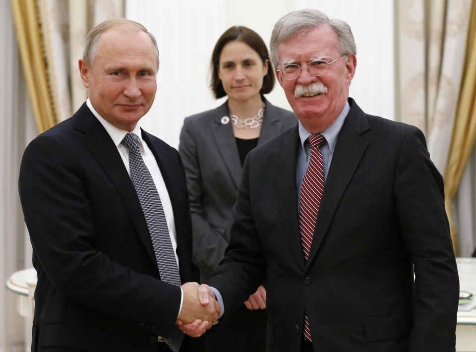 Russian President Vladimir Putin, left, shakes hands with U.S. National security adviser John Bolton during their meeting in the Kremlin in Moscow, Russia, Tuesday, Oct. 23, 2018. (AP Photo/Alexander Zemlianichenko)