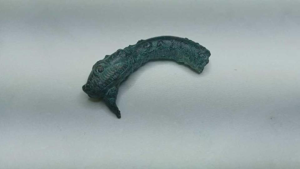 A bronze snake head was among the artifacts found at the site. Greece Ministry of Culture