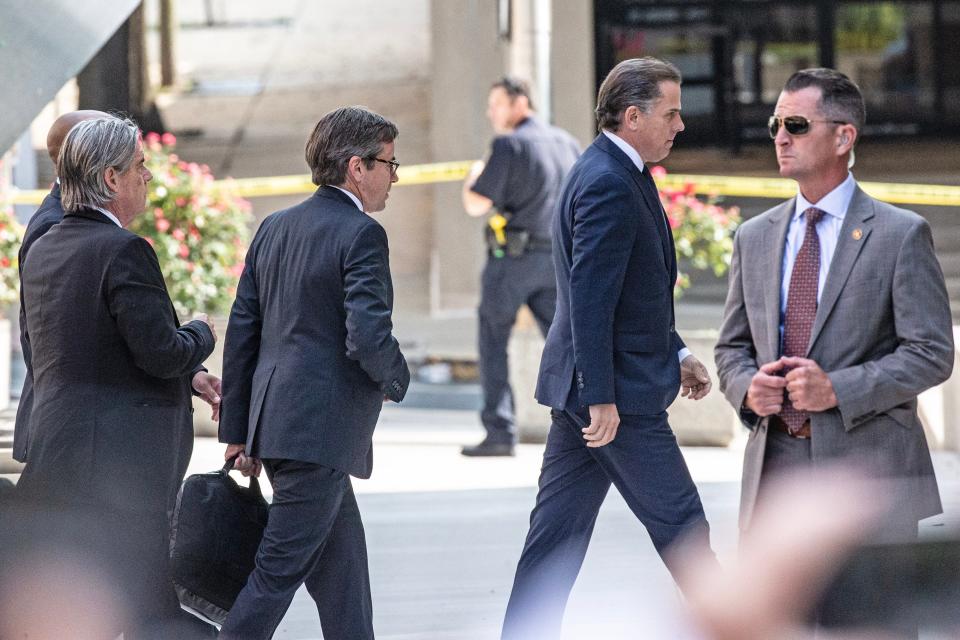 Hunter Biden and his legal team arrive for a hearing regarding his criminal tax case at the J. Caleb Boggs Federal Building in Wilmington, Wednesday, July 26, 2023.