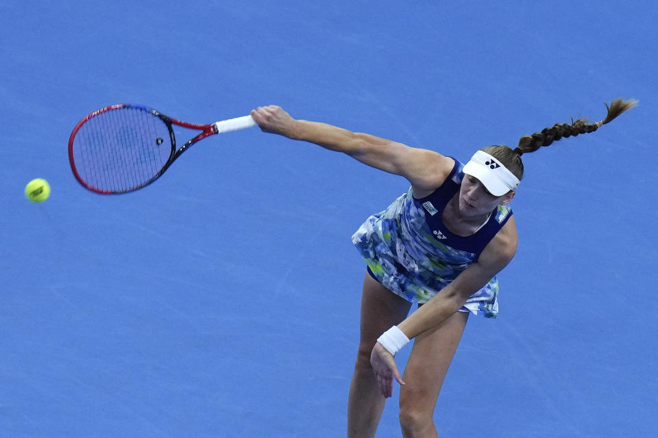 Elena Rybakina of Kazakhstan serves against Aryna Sabalenka of Belarus during the women's singles quarterfinal match in the China Open tennis tournament at the Diamond Court in Beijing, Friday, Oct. 6, 2023. (AP Photo/Andy Wong)