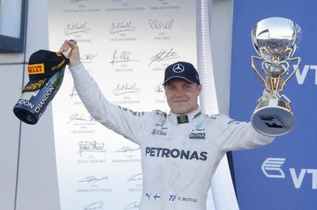 Formula One - F1 - Russian Grand Prix - Sochi, Russia - 30/04/17 - Mercedes Formula One driver Valtteri Bottas of Finland celebrates the victory on the podium. REUTERS/Maxim Shemetov