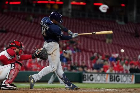 Apr 1, 2019; Cincinnati, OH, USA; Milwaukee Brewers left fielder Ryan Braun (8) hits an RBI double against the Cincinnati Reds in the ninth inning at Great American Ball Park. Mandatory Credit: Aaron Doster-USA TODAY Sports