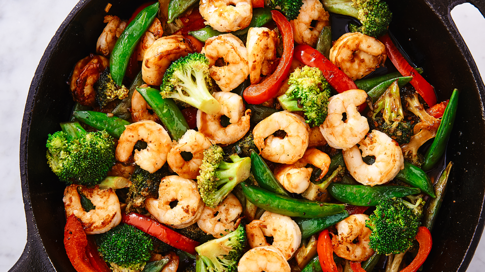 a plate of shrimp and vegetables