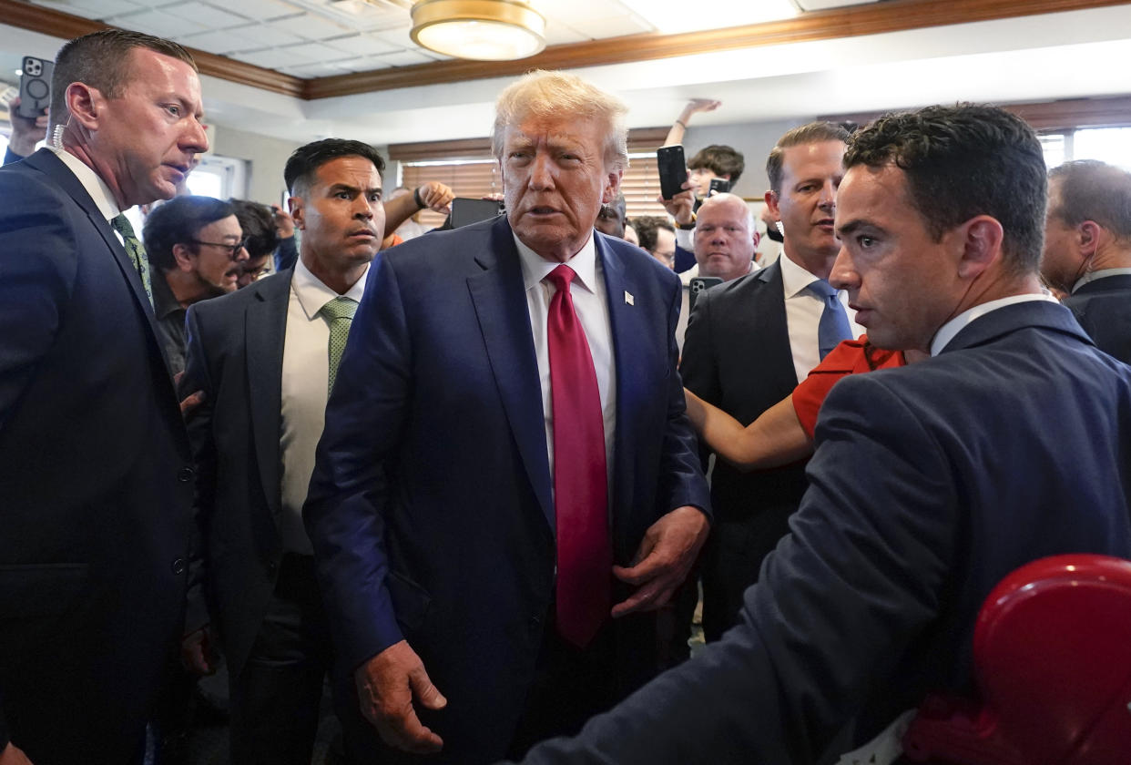 Former President Donald Trump visits a restaurant after his arraignment on Tuesday in Miami. 