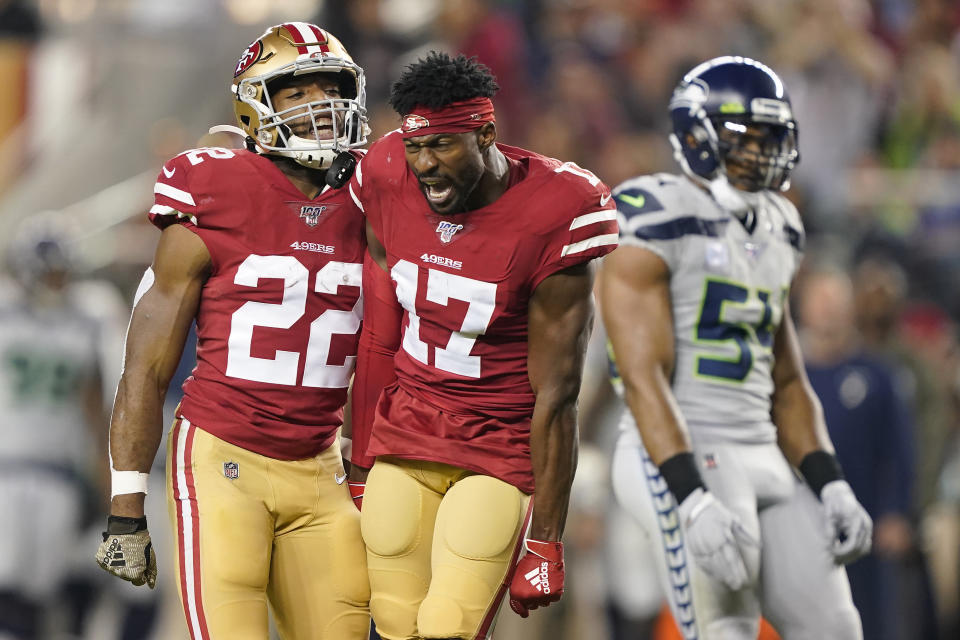 San Francisco 49ers wide receiver Emmanuel Sanders (17) yells next to running back Matt Breida (22) and Seattle Seahawks middle linebacker Bobby Wagner (54) during the first half of an NFL football game in Santa Clara, Calif., Monday, Nov. 11, 2019. (AP Photo/Tony Avelar)