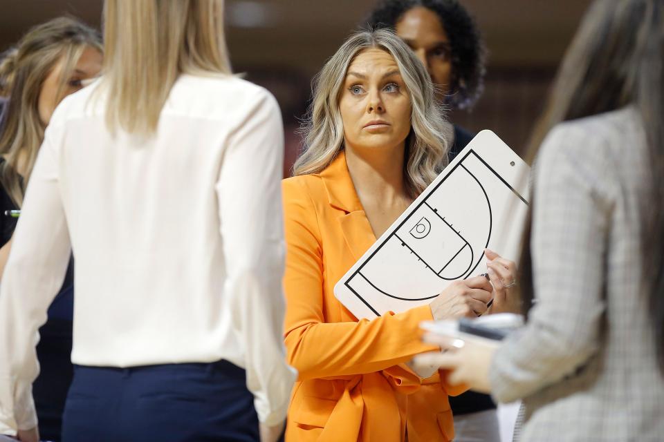 Oklahoma State head coach Jacie Hoyt holds a clipboard during a women's college basketball game between the Oklahoma State Cowgirls (OSU) and the UT Rio Grande Valley Vaqueros at Gallagher-Iba Arena in Stillwater, Okla., Monday, Nov. 7, 2022.