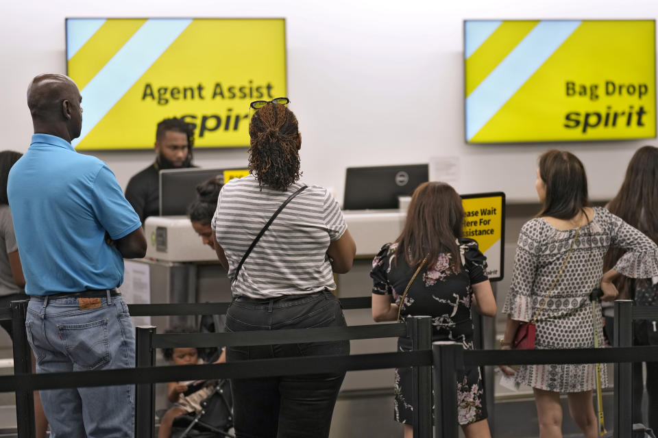 Passengers wait in a line for help at the Spirit Airlines ticket counter at the Tampa International Airport Thursday, June 1, 2023, in Tampa, Fla. Spirit Airlines and Air Canada have delays due to technical problems. (AP Photo/Chris O'Meara)