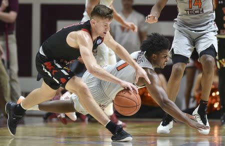 Dec 5, 2018; Blacksburg, VA, USA; Virginia Military Institute Keydets guard Garrett Gilkeson (2) battles for a loose ball with Virginia Tech Hokies guard Isaiah Wilkins (1) in the second half at Cassell Coliseum. Michael Shroyer-USA TODAY Sports