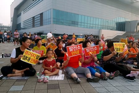 People attend a protest against hydrogen fuel cells power plant in Incheon