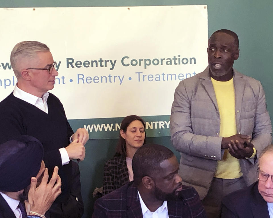 Actor Michael K. Williams, right, speaks at news conference on prisoner re-entry sponsored by New Jersey Re-entry Corporation in Newark, N.J., Friday, Feb. 14, 2020. At left is NJRC chairman and former New Jersey Gov. Jim McGreevey. At lower left is New Jersey Attorney General Gurbir Grewal. (AP Photo/David Porter)