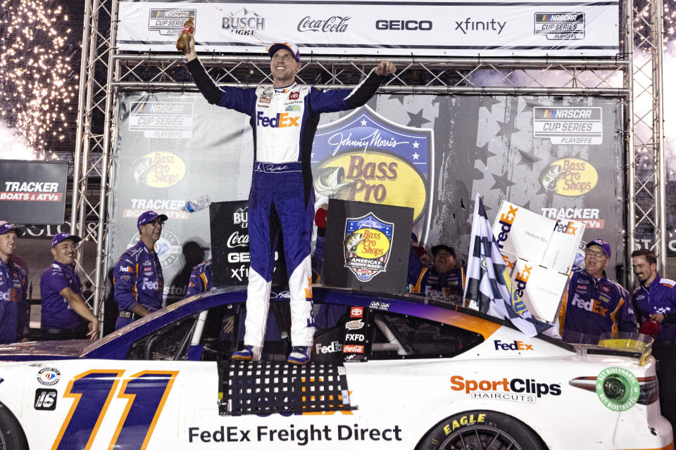 Denny Hamlin celebrates his victory in the NASCAR Cup Series auto race Saturday, Sept. 16, 2023, in Bristol, Tenn. (AP Photo/Wade Payne)