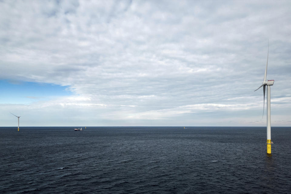 The first operating South Fork Wind farm turbine, Thursday, Dec. 7, 2023, 35 miles east of Montauk Point, N.Y. The turbine at the commercial-scale offshore wind farm is producing power for the U.S. electric grid for the first time. (AP Photo/Julia Nikhinson)