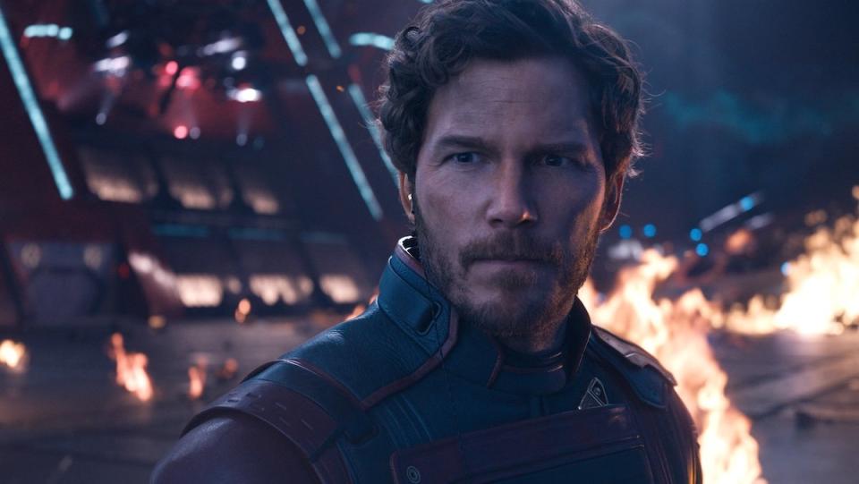 Star-Lord looks sterns as explosions go off behind him in Guardians of the Galaxy Vol. 3