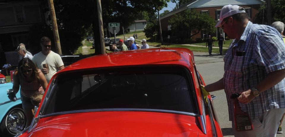 Gary Allwine of Grove City, shines his 1963 Studebaker during the Loudonville Car Show held Saturday July 2,2022 in downtown Loudonville.