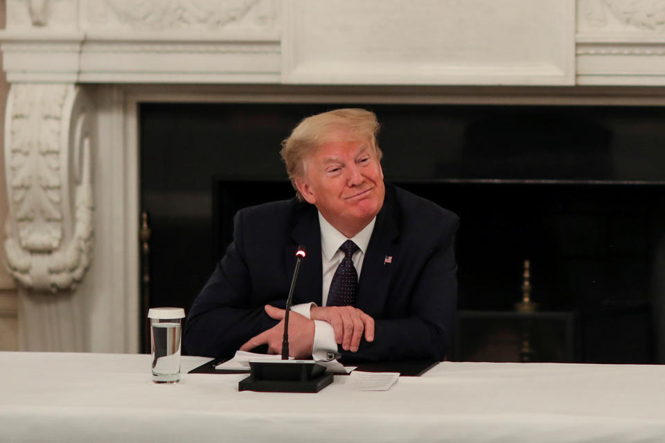 U.S. President Donald Trump speaks with restaurant executives and industry leaders during a coronavirus disease (COVID-19) pandemic meeting in the State Dining Room at the White House in Washington, U.S., May 18, 2020. REUTERS/Leah Millis     TPX IMAGES OF THE DAY